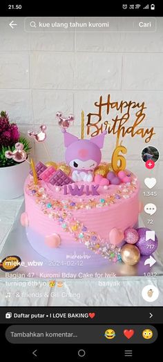 a birthday cake with pink frosting and decorations