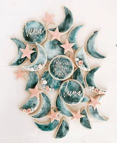 cookies decorated with moon and stars are arranged in the shape of a star, which reads luna