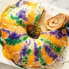 a bundt cake covered in colorful sprinkles