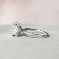 a white gold engagement ring with a princess cut diamond