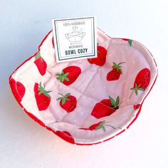 a small bowl has strawberries on it