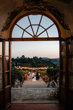 the bride and groom are standing at the entrance to their wedding ceremony