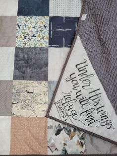 a patchwork quilt with words written on it