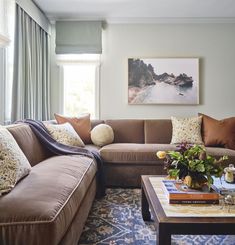 a living room filled with furniture and pillows