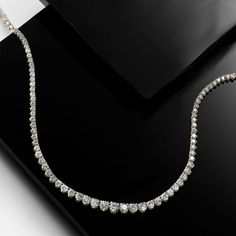 Ross-Simons - 5.50ct t. w. Graduated Lab Grown Diamond Tennis Necklace. 20". It's your time to shine! Our graduated tennis necklace is a forever favorite that comes at an incredible value, glistening from end to end with 5.50 ct. t. w. round brilliant-cut lab-grown diamonds. Crafted in high-polished 14kt yellow gold. Graduates from 1/16" to 1/8" wide. Lab-grown diamonds are identical to mined diamonds according to their optical, physical and chemical properties. All Ross-Simons lab-grown diamond Luxury Single Strand Tennis Necklace For Anniversary, Timeless Diamond White Tennis Necklace For Anniversary, Fine Jewelry Single Strand Tennis Necklace For Anniversary, Diamond White Single Strand Tennis Necklace For Anniversary, Timeless Tennis Necklace With 17 Jewels For Anniversary, Timeless Jeweled Tennis Necklace For Anniversary, Fine Jewelry Tennis Necklace With 17 Jewels For Anniversary, Fine Jewelry Tennis Necklace For Anniversary, Timeless Yellow Gold Tennis Necklace With Prong Setting