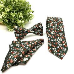 "Olive Green Floral Tie, Burnt Orange Floral Tie, Wedding Floral Ties, Groomsmen Floral Tie, Groom Gift Tie, Wedding Tie ■ All our neck ties can be made in the following dimensions,   BOWTIE DIMENSIONS: ADULT, 2.75\" (7cm) wide at its widest point and 61\" (155cm) long - standard length and width. Hand rolled and hand sewn. Do you need a special color? Please contact me. » Wedding days (groom and groomsman), Birthday parties, Graduation days etc. We accept special orders for your elite occasions. ■ Not: Colors and patterns may not always be the same as a picture. Depending on the fabric manufacturer's colors and the fabric pattern of your choice. *My products are handmade and completely my own products. (Istanbul Turkey)" Fitted White Sets With Bow Tie, White Fitted Sets With Bow Tie, Green Bow Tie For Weddings, Green Bow Tie For Wedding, Fitted Green Ties For Wedding, Green Standard Tie For Wedding, Fitted Wedding Suit With Bow Tie, Green Fitted Suit And Tie Accessories For Party, Fitted Green Suit And Tie Accessories For Party