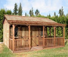 a wooden gazebo sitting on top of a lush green field next to a forest