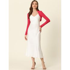 This versatile shrug is a must-have for any fashion-forward wardrobe. Its soft and lightweight knit material makes it comfortable to wear, while the long sleeves and crop length offer a chic and modern look. The clean, collarless silhouette is precisely cropped above the waist, making it the perfect cover-up for any occasion or event. You can easily pair it with a white dress or sleeveless dress to showcase your graceful gesture. With its contemporary design and effortless style, this shrug is s Fitted V-neck Shrug For Spring, Chic V-neck Shrug For Spring, Long Sleeve Stretch Shrug For Spring, Stretch Long Sleeve Shrug For Spring, White Long Sleeve Shrug For Fall, Chic Long Sleeve Shrug For Layering, White Long Sleeve Shrug For Spring, Long Sleeve Shrug For Spring, White Stretch Long Sleeve Shrug