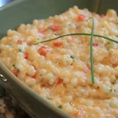 a bowl filled with macaroni and cheese on top of rice