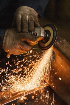 welder cutting metal with grinder and sparks by jordil for stocks on artfire