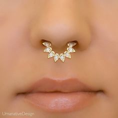 A 14k gold septum clicker set with 0.24ct genuine white diamonds for just the right amount of sparkle.  Materials: * 14k solid gold (Weight: 1.4g) - Available in yellow gold, rose gold or white gold. * Genuine white diamond (Weight: 0.24ct VS-SI/G-H) Measurements:      Inner diameter of the ring: 05/16" - 8mm Wire thickness: 16g - 1.2mm Number of diamonds: 8 Diamond size: 2mm * Nickel free and hypoallergenic To keep your jewelry looking new, take a soft cloth or toothbrush with mild soap and gen Elegant Diamond Septum Ring With Accents, Gold Diamond Septum Ring With Prong Setting, Gold Diamond Septum Ring As Gift, Diamond Septum Ring In Yellow Gold For Wedding, Elegant Gold Septum Ring With Diamond Accents, Yellow Gold Diamond Septum Ring For Wedding, Diamond Yellow Gold Septum Ring Gift, Yellow Gold Diamond Septum Ring Gift, Diamond Septum Ring With Prong Setting For Wedding