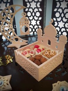 a box filled with lots of different types of food on top of a black table