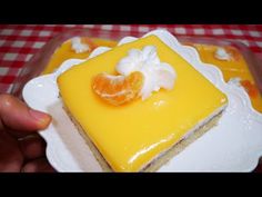 there is a piece of cake with oranges on it