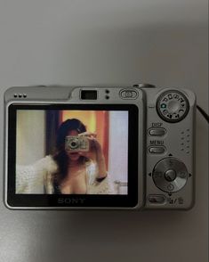 a camera with a woman's face on the screen