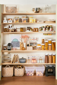 the shelves in this kitchen are filled with various foods and condiments to eat