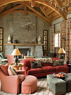 a living room filled with furniture and a fire place