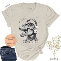 T-Rex t-shirt, funny dinosaur tshirt, black and white Tyrannosaurus Rex tee, gift for dinosaur lover, paleontologist gift, unique tshirt, trendy t-shirt, gift for dad, gift for friend, music lover gift, abstract shirt, Father's Day gift For all you awesome, unique folks, get ready to stand out in the crowd with our awesome T-Rex tee! With its vibrant colors, comfy fit, and hilarious design, this shirt is bound to become your new favorite. Get ready to turn heads and rock your individuality! This Unique Tshirt, Dinosaur Tshirt, T Rex Humor, Dinosaur Tee, Funny Dinosaur, Abstract Shirt, Couples Outfit, Dinosaur Funny, Tyrannosaurus Rex