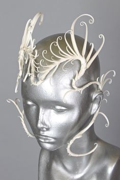 td {border: 1px solid #ccc;}br {mso-data-placement:same-cell;} This is a one of a kind piece of wearable art made for the Five and Diamond Eighth Annual Headgear Art Show and shown on June 12, 2020. A white, feathery, angelic face mask which frames the eyes and forehead of the wearer in rhythmic flowing spines. Named for the Watchers of Biblical Apocrypha and occult poetic tradition, the "illustrious fallen angels" of Eliphas Levi's writings, which have in contemporary hermeticism been reinterpr Wearable Sculpture Headpieces, Mermaid Mask, Angelic Face, Fun Fits, Fantasy Inspo, 60s Makeup, Angel Costume, Fallen Angels, Mermaid Aesthetic