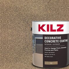 a paint can sitting on top of a floor next to a brown wall with the words kilz decorative concrete coating