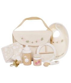 the contents of a baby's diaper bag, including bottles and feeding utensils