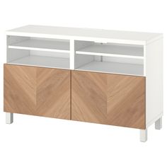 a white and wood entertainment center with two doors on one side, an open shelf to the other