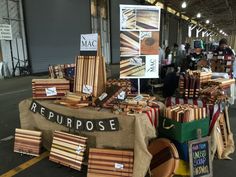 many pieces of wood are on display at an outdoor market