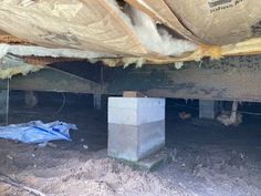 the inside of a house under construction with tarp covering it's walls and floor