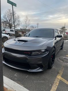 a black car parked on the side of the road