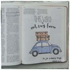 an open book with a drawing of a car and luggage on it's back