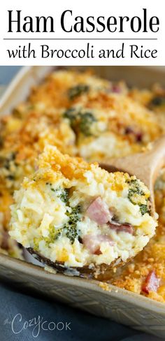 ham casserole with broccoli and rice in a baking dish on a wooden spoon