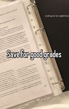 an open book sitting on top of a table next to a pen and paper with the words save for good grade