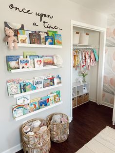 a child's room with bookshelves and baskets on the floor in front of it