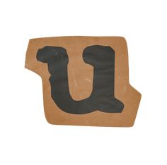 the letter u is made out of cardboard and has black paint on it's side