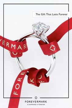 a diamond ring with red ribbon around it and the words for love written on it