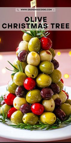 a christmas tree made out of olives on a plate with the words olive christmas tree