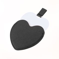 a black and white heart shaped luggage tag on a white background with a black strap