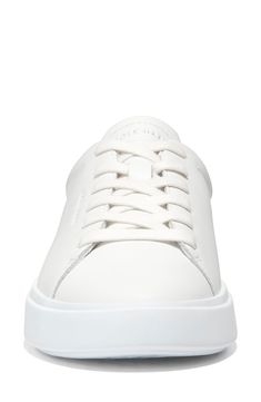 This sleek leather sneaker with clean lines inspired by classic tennis styles has rubber caps at the toe and heel for added traction. Round toe Lace-up style Removable cushioned footbed Leather upper/textile lining/synthetic and rubber sole Imported Up Styles, Cole Haan, Leather Sneakers, Clean Lines, Rubber Sole, Leather Upper, Tennis, Nordstrom, Sleek