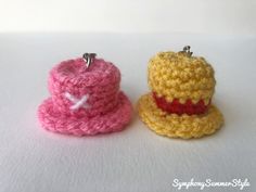 two small crocheted hats sitting next to each other