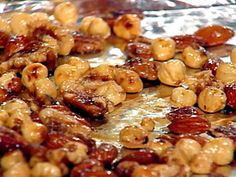 nuts and raisins are being cooked on tin foil