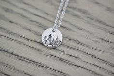 Evergreen Tree Necklace - Treescape Necklace - Winter Tree Forest Necklace - Small Tree Charm Pendant - Aluminum disc is lightweight, very low skin reaction rate, won't tarnish & won't turn your skin green! - Each disc is hand punched, tumbled to an awesome shine, stamped by hand, and then oxidized for contrast - Aluminum Disc is 1/2 inch (13mm) (1.25cm) - Smaller than a dime (see photo 5) - Chain options are an 18 inch or 24 inch Stainless Steel Cable Link Chain with Lobster Claw (Shown) or Nature-inspired Personalized Jewelry For Everyday, Nature-inspired Personalized Everyday Jewelry, Green Nature-inspired Everyday Jewelry, Everyday Green Nature-inspired Jewelry, Forest Necklace, Winter Tree, Stainless Steel Cable, Tree Necklace, Tree Forest