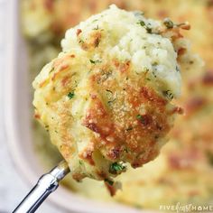 a close up of a spoon with food in it