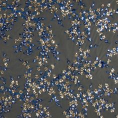 blue and silver sequins are scattered on a gray surface in this aerial photo