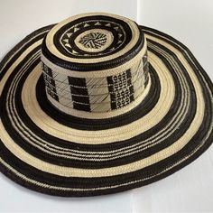 Original Sombrero Vueltiao Hat, Imported From Colombia Made By Zenu People Original Piece Tradicional Design Can Be Fold And Restores The Original Shape Black Toquilla Straw Hat With Flat Brim, Black Wide Brim Toquilla Straw Hat, Black Flat Brim Toquilla Straw Hat, Black Artisan Fedora With Flat Brim, Artisan Black Fedora Hat, Artisan Black Fedora With Flat Brim, Artisan Black Flat Brim Fedora, Black Woven Panama Hat With Flat Brim, Black Brimmed Toquilla Straw Hat