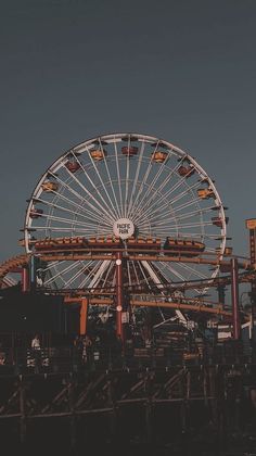 a ferris wheel sitting on top of a pier