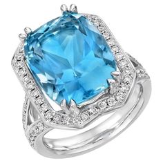 a blue topazte and diamond ring set in 18k white gold with diamonds