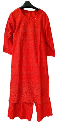 This simple yet stylish palazzo suit is made in red Chikankari embroidery cotton fabric with self work sequins. The kurti is designed with full sleeves and a V-neck. An elegant dazzling outfit for any occasion! Fabric: Chikankari Cotton  Lining: Taffeta Stitching: Fully Stitched Care: Dry clean recommended Message: Please feel free to contact us to customize this outfit or any other queries. Note: Product color may slightly differ from the image. Please note the we offer expediate shipping, that only speeds up the shipping time, our processing time will not be effected. Red Salwar Kameez With Mirror Work Straight Kurta, Red Straight Kurta With Mirror Work, Red Semi-stitched Kurta With Mirror Work, Red Palazzo Set With Chikankari Embroidery And Straight Kurta, Red Cotton Palazzo Set With Chikankari Embroidery, Red Chikankari Embroidery Sharara For Designer Wear, Traditional Red Palazzo Set With Chikankari Embroidery, Festive Red Kurta With Mirror Work, Red Long Sleeve Palazzo Set For Festivals