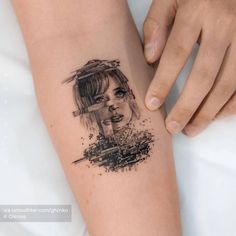 a woman's arm with a tattoo on it