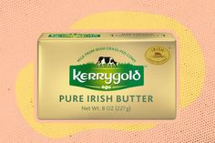 a box of butter sitting on top of a pink and yellow background with the words kerry gold