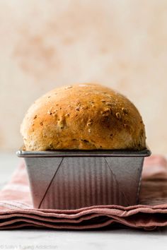 a loaf of bread sitting on top of a metal pan