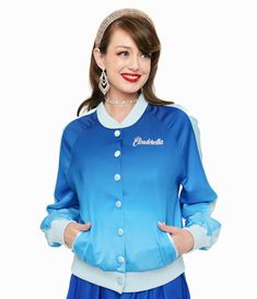 This beautiful bomber style jacket, in collaboration with Disney, is crafted in a blue ombre satin-like fabric. Outfitted with a snap button up front, long sleeves, side pockets, and a large screen print on the back of Princess Cinderella's castle with the words, "Happily Ever After". Complete with "Cinderella" embroidered on the chest. Vintage Cinderella, Sweater Jacket